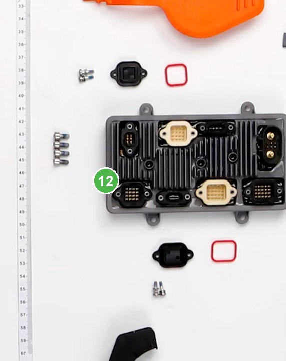 Placa de Control de Carga Útil señalada con el número 12 en el diagrama de despiece del DJI Agras T100